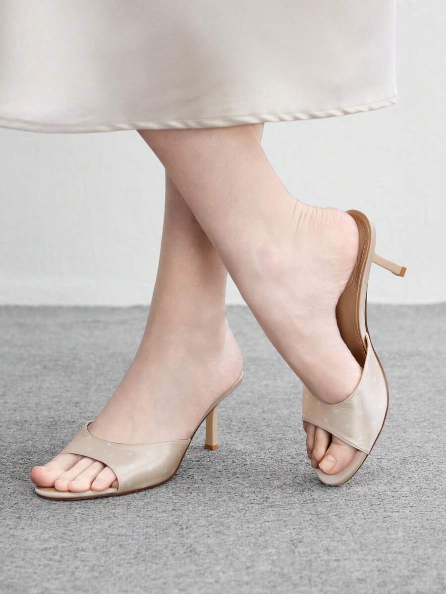 Pair of women's open toe high heel slingback sandals made with smooth PU leather