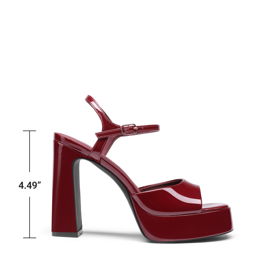 Women's open toe chunky high heel sandals featuring a platform sole, buckle ankle strap, and plain PU leather finish.
