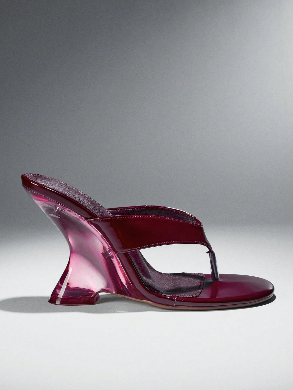 Women's slip-on thong strap wedge sandals featuring a high wedge heel and smooth PU leather upper.