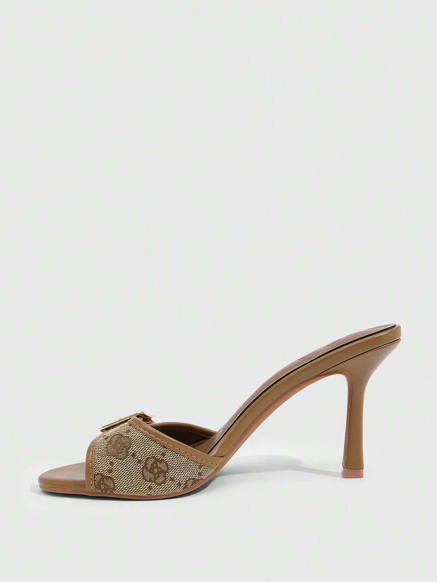 Women's brown leopard print high heel mule sandals with gold-tone buckle and grommet eyelet accents.