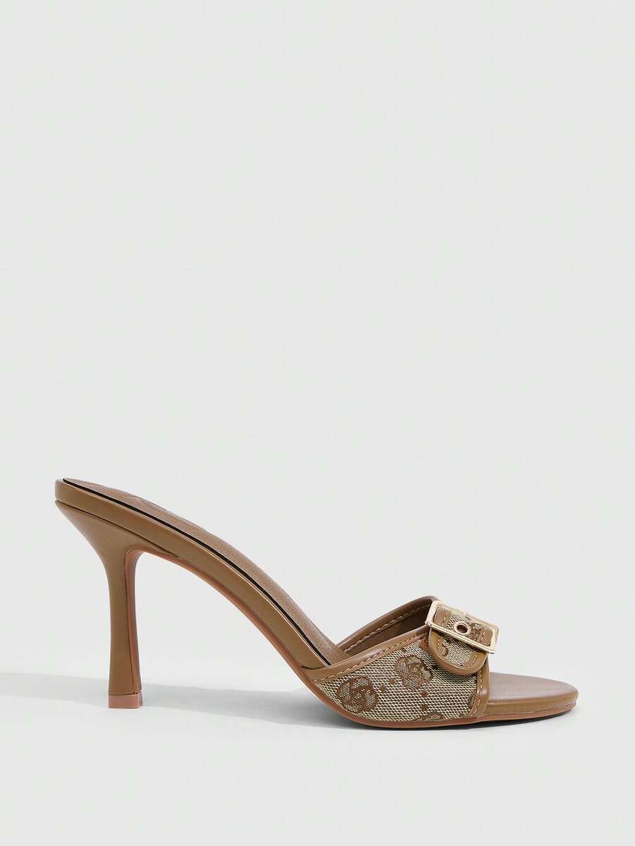Women's brown leopard print high heel mule sandals with gold-tone buckle and grommet eyelet accents.