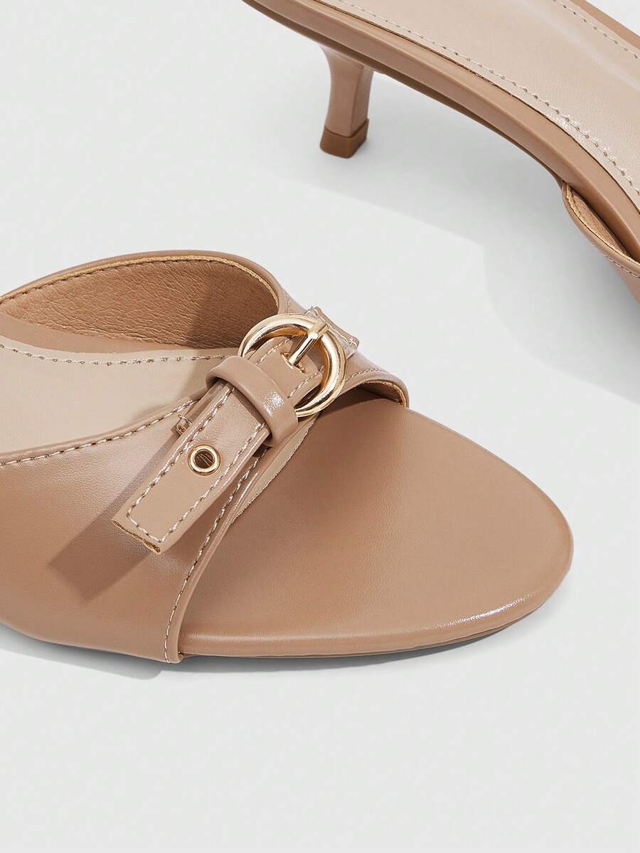 Women's light gold kitten heel slingback sandals featuring an open toe and round buckle strap.