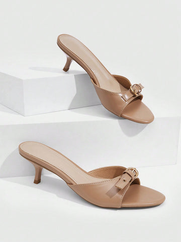 Women's light gold kitten heel slingback sandals featuring an open toe and round buckle strap.