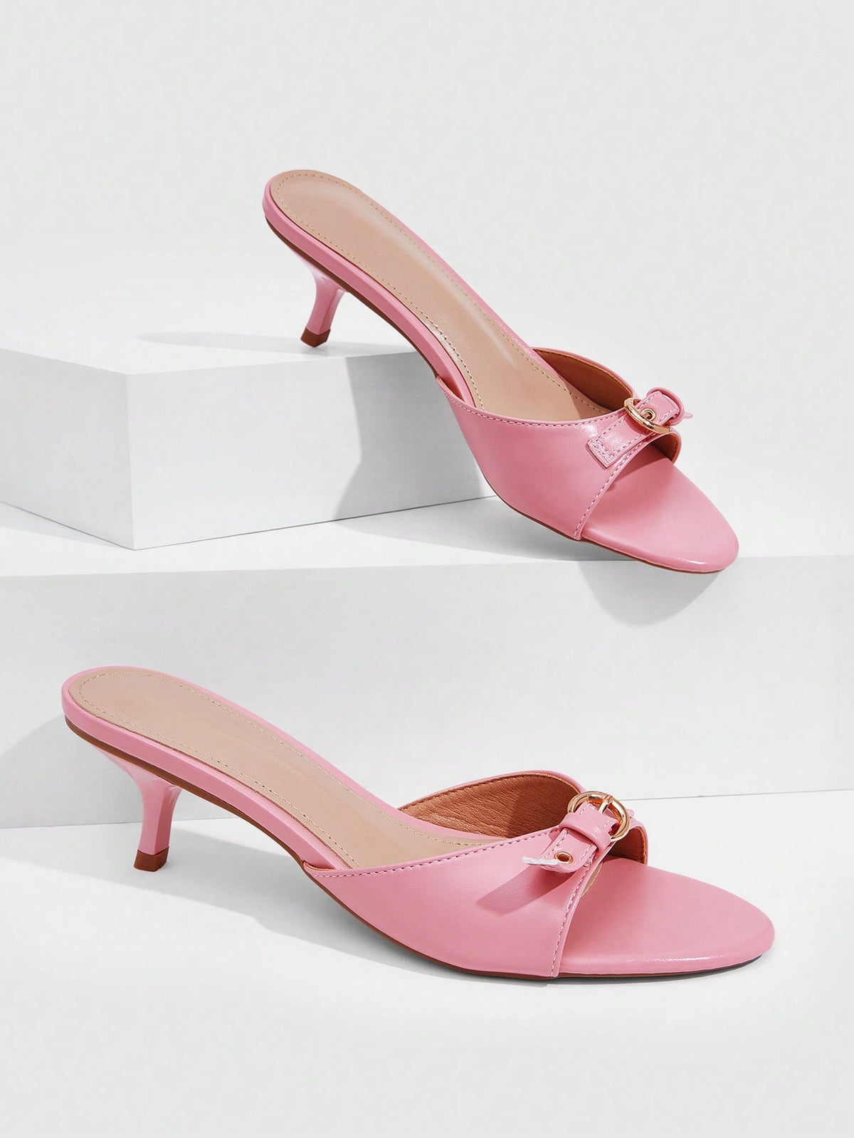 Women's light gold kitten heel slingback sandals featuring an open toe and round buckle strap.
