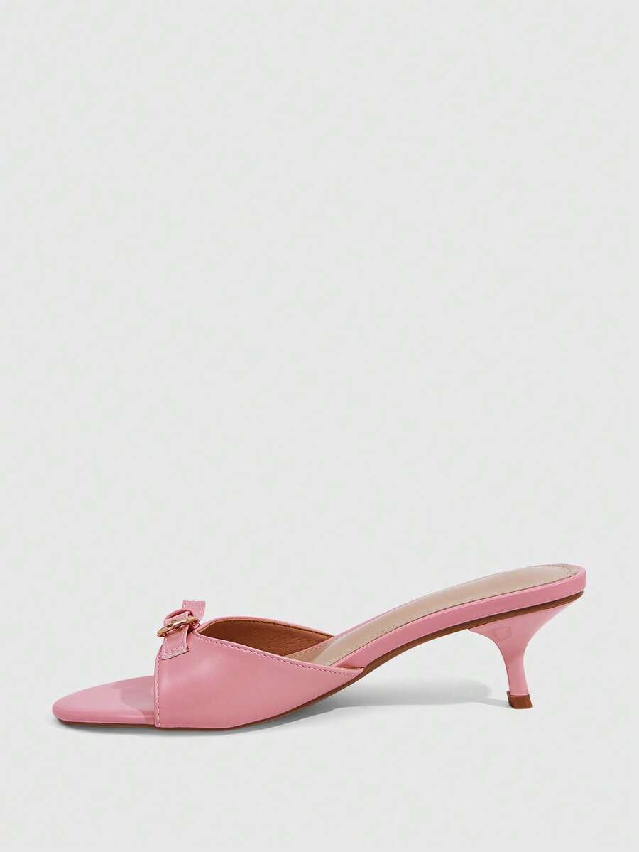 Women's light gold kitten heel slingback sandals featuring an open toe and round buckle strap.