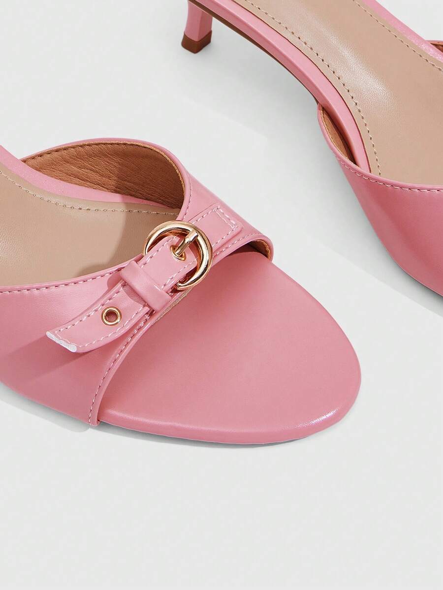 Women's light gold kitten heel slingback sandals featuring an open toe and round buckle strap.
