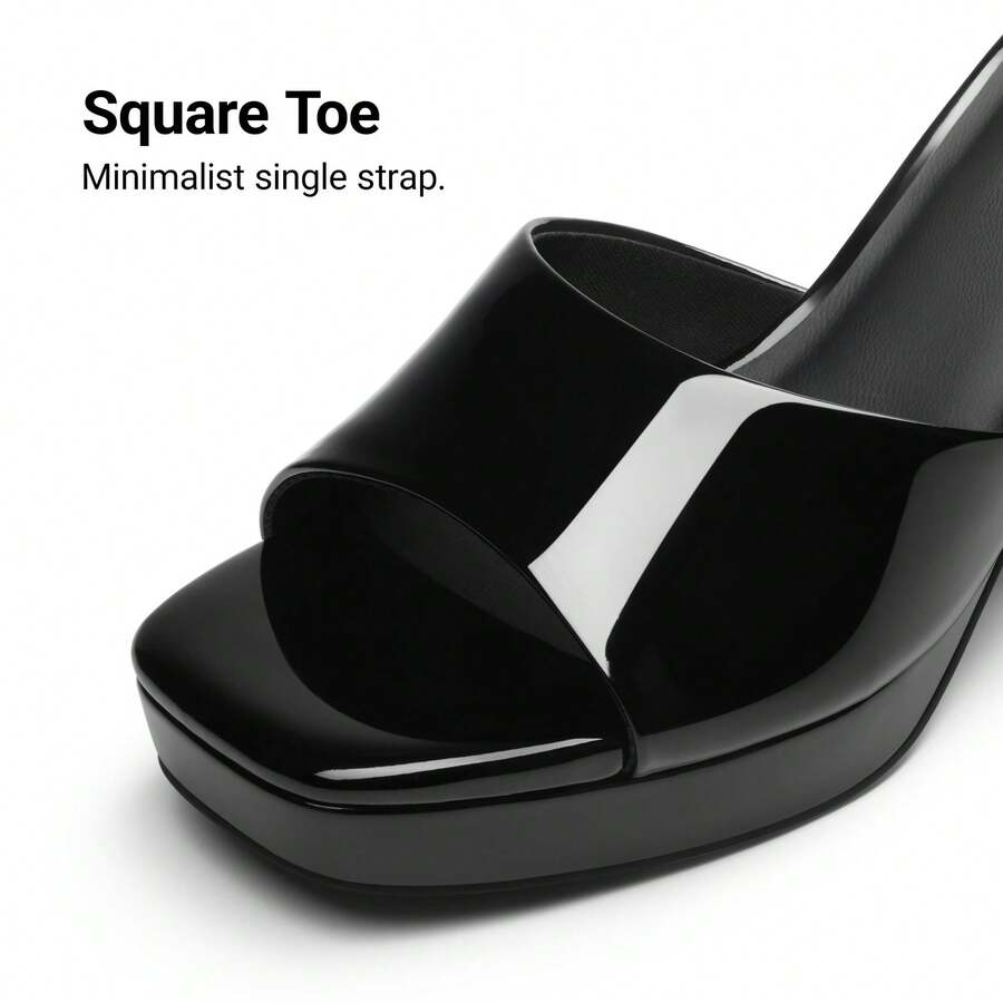 Women's minimalist open toe mule sandals featuring a chunky low heel, wide single strap, and slip-on design.
