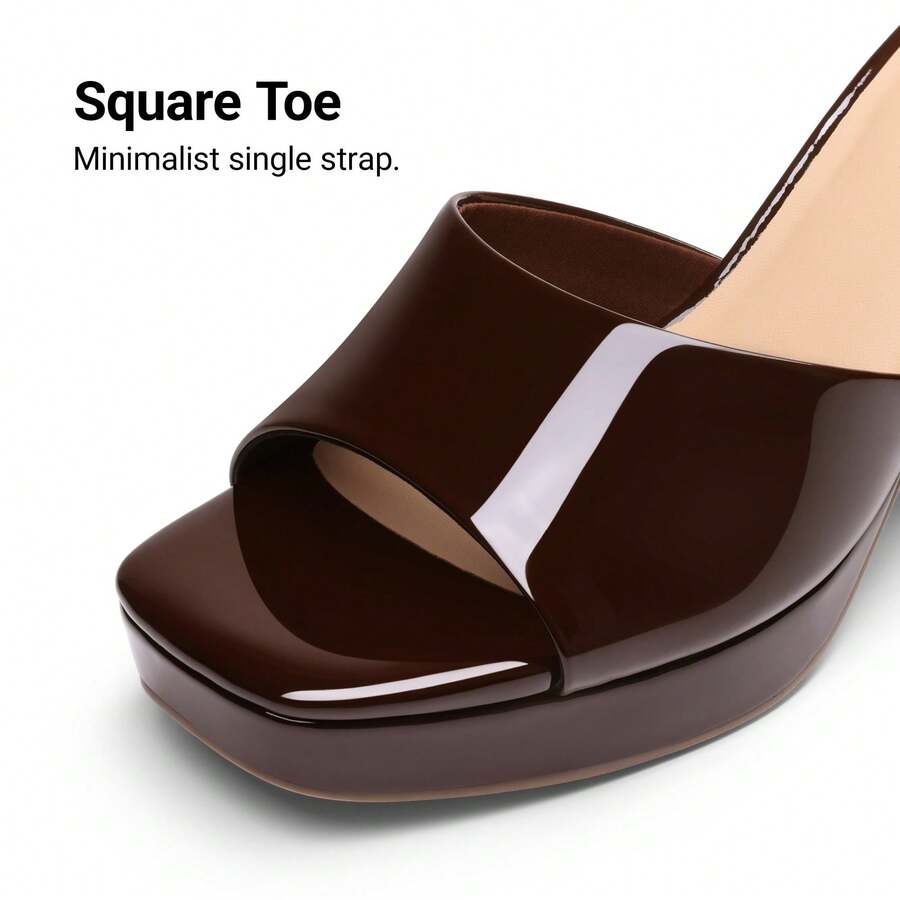 Women's minimalist open toe mule sandals featuring a chunky low heel, wide single strap, and slip-on design.