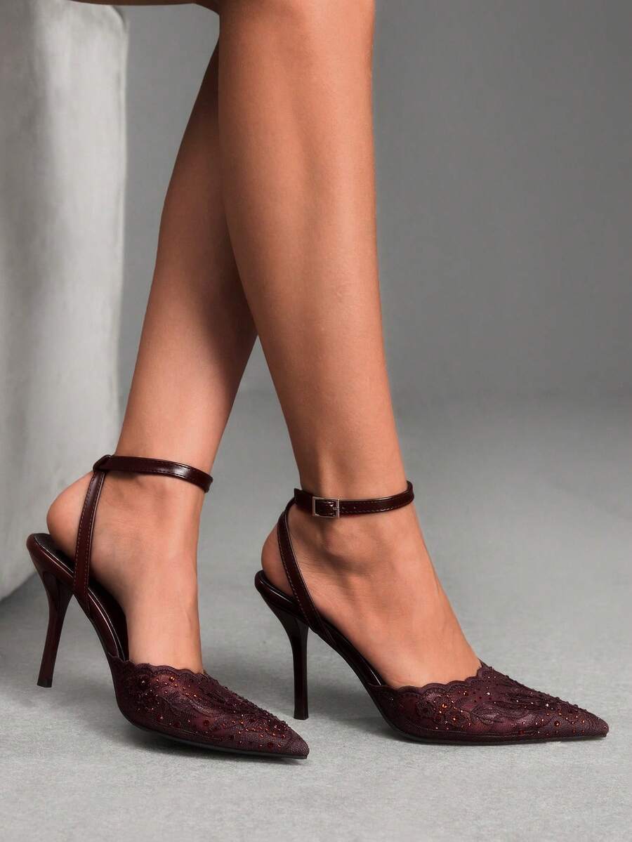 Women's stiletto high heel shoes featuring an elegant buckle detail and ankle strap slingback design.