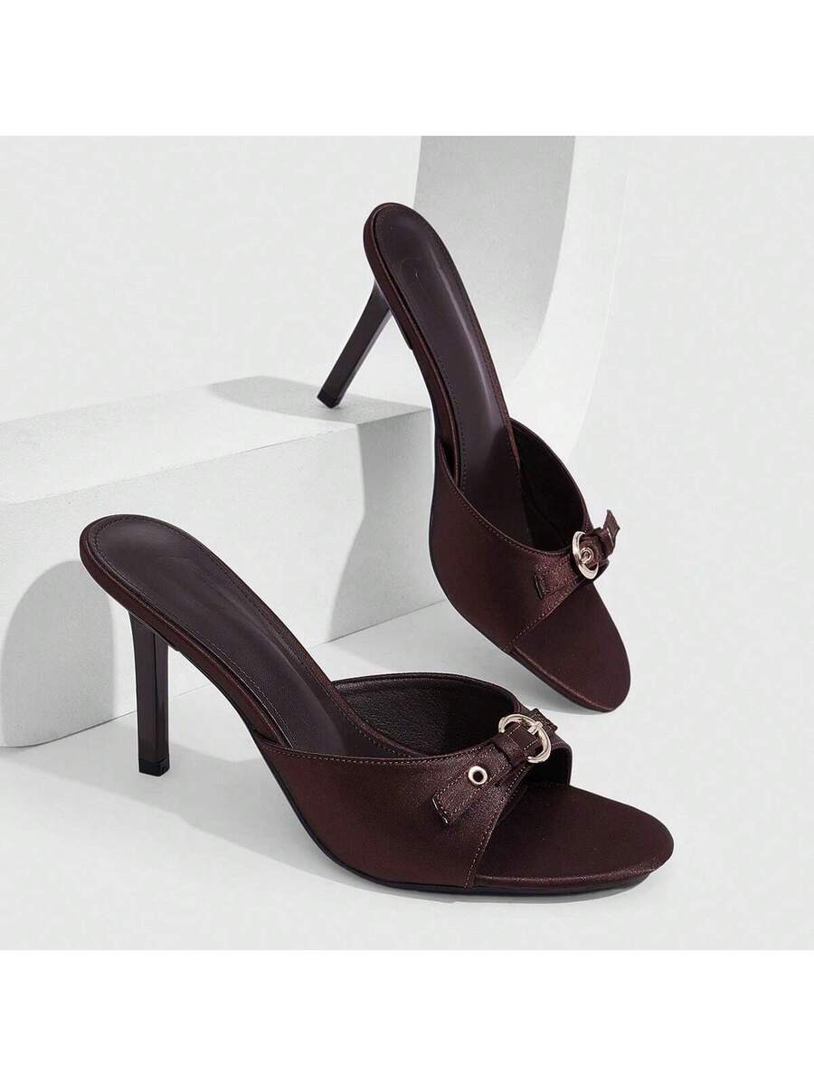 Elegant burgundy high heel slingback sandals with an open toe and round buckle strap.