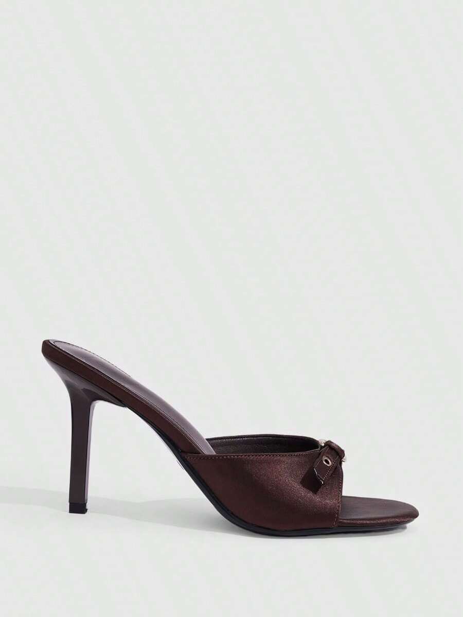 Elegant burgundy high heel slingback sandals with an open toe and round buckle strap.