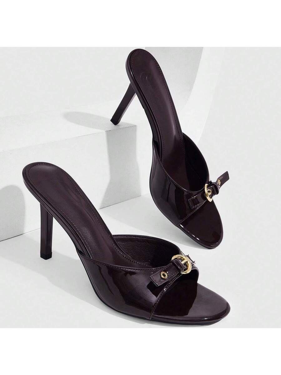 Women's light gold kitten heel slingback sandals featuring an open toe and round buckle strap.