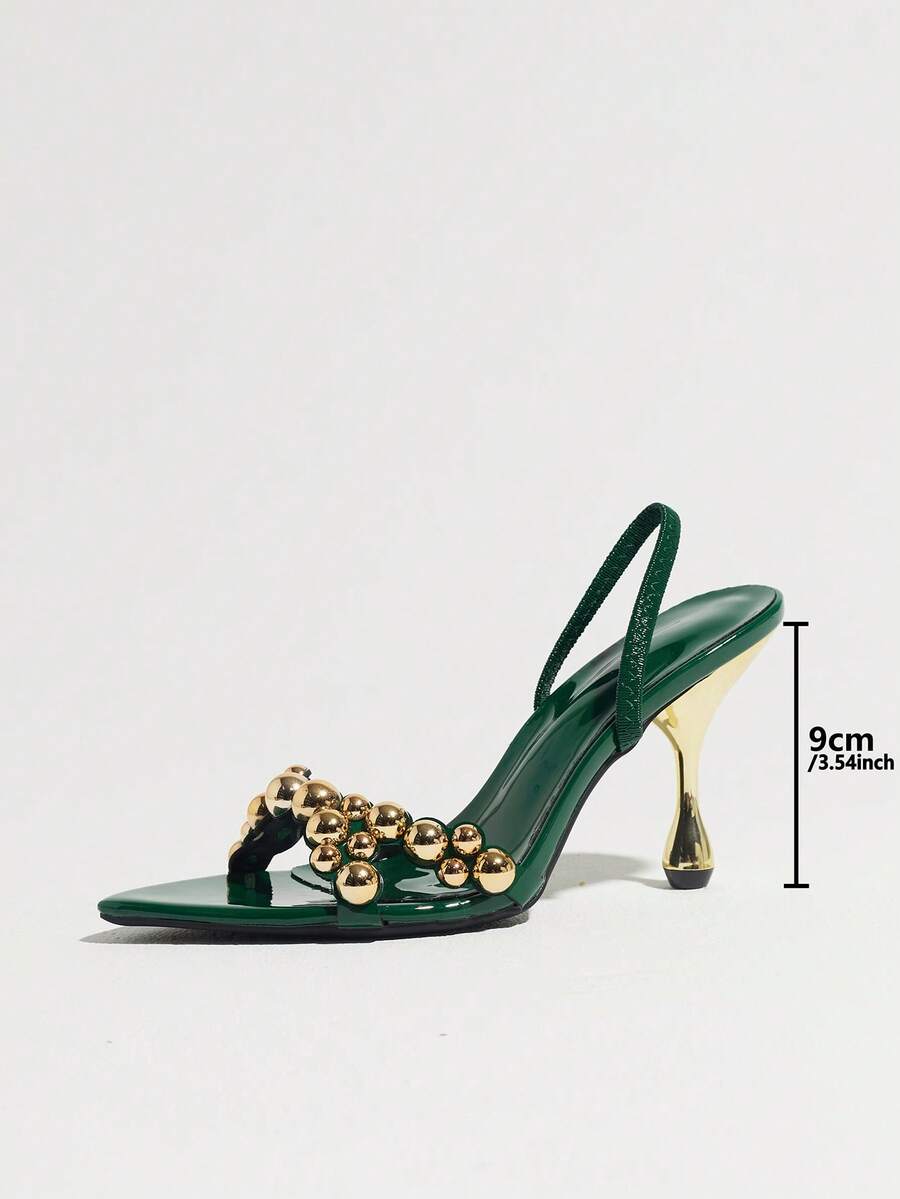 Pointed toe party high heels in gold featuring wavy lace trim, a stiletto heel, and back tie slingback straps.
