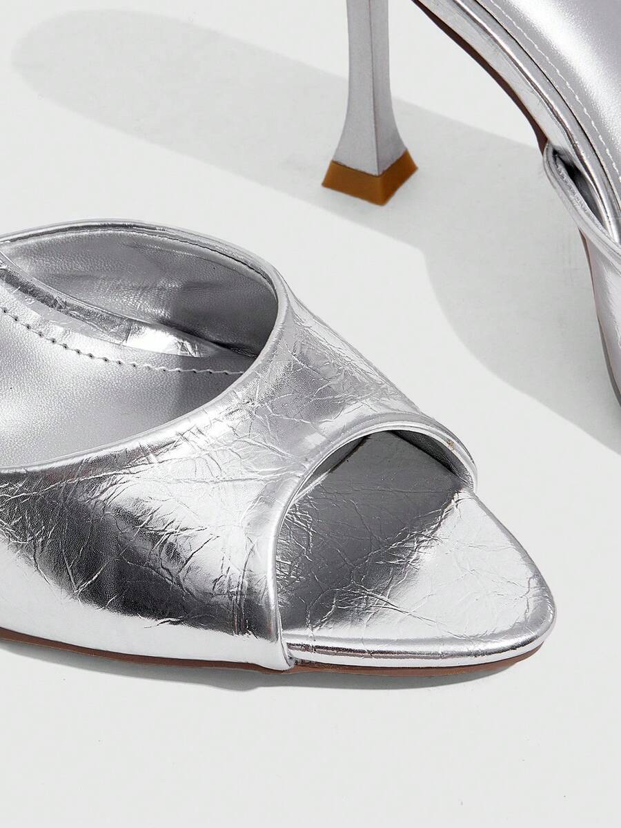 Women's sleek high heel slingback sandals with PU leather finish and stylish pyramid heel.