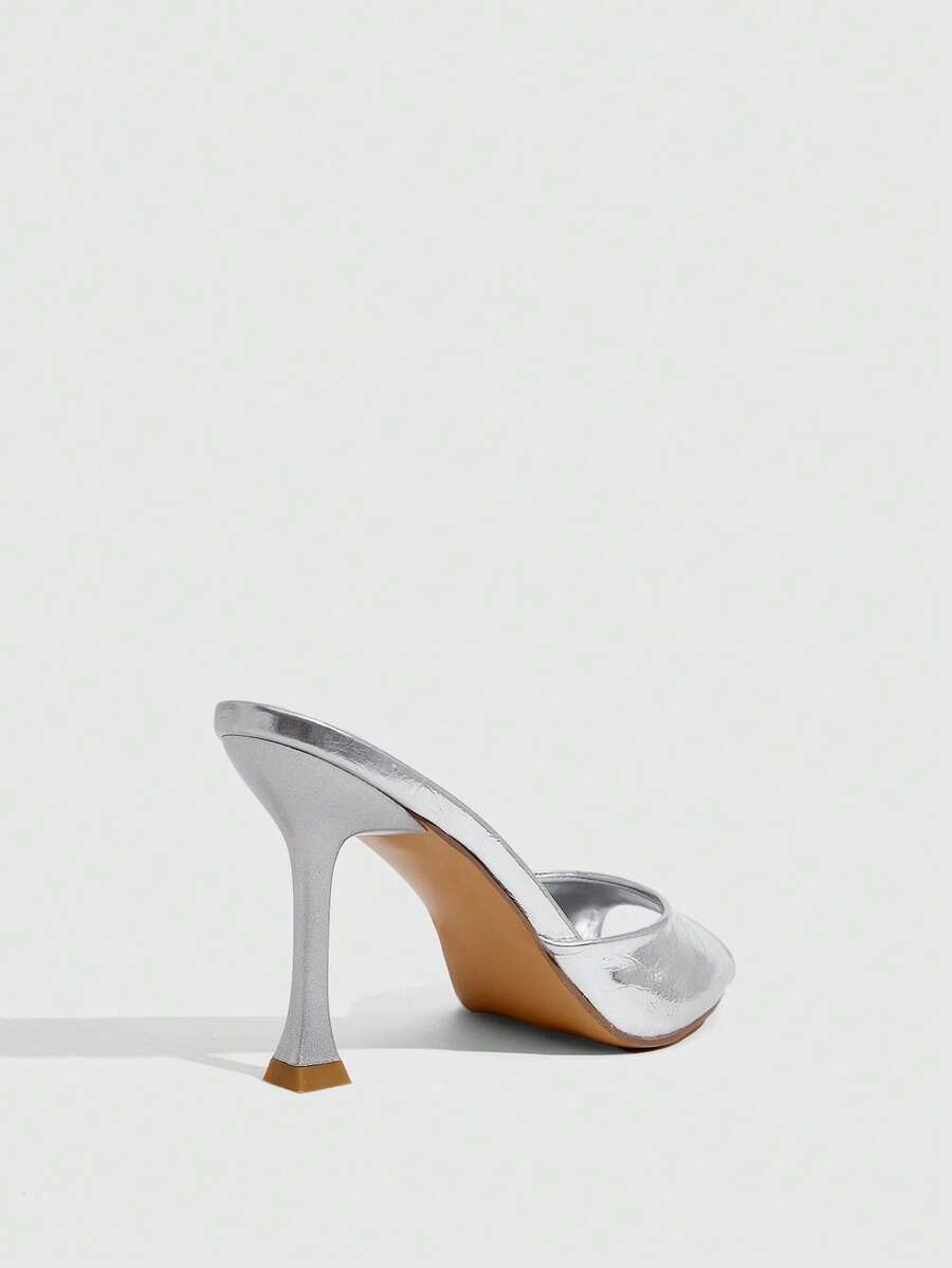 Women's sleek high heel slingback sandals with PU leather finish and stylish pyramid heel.