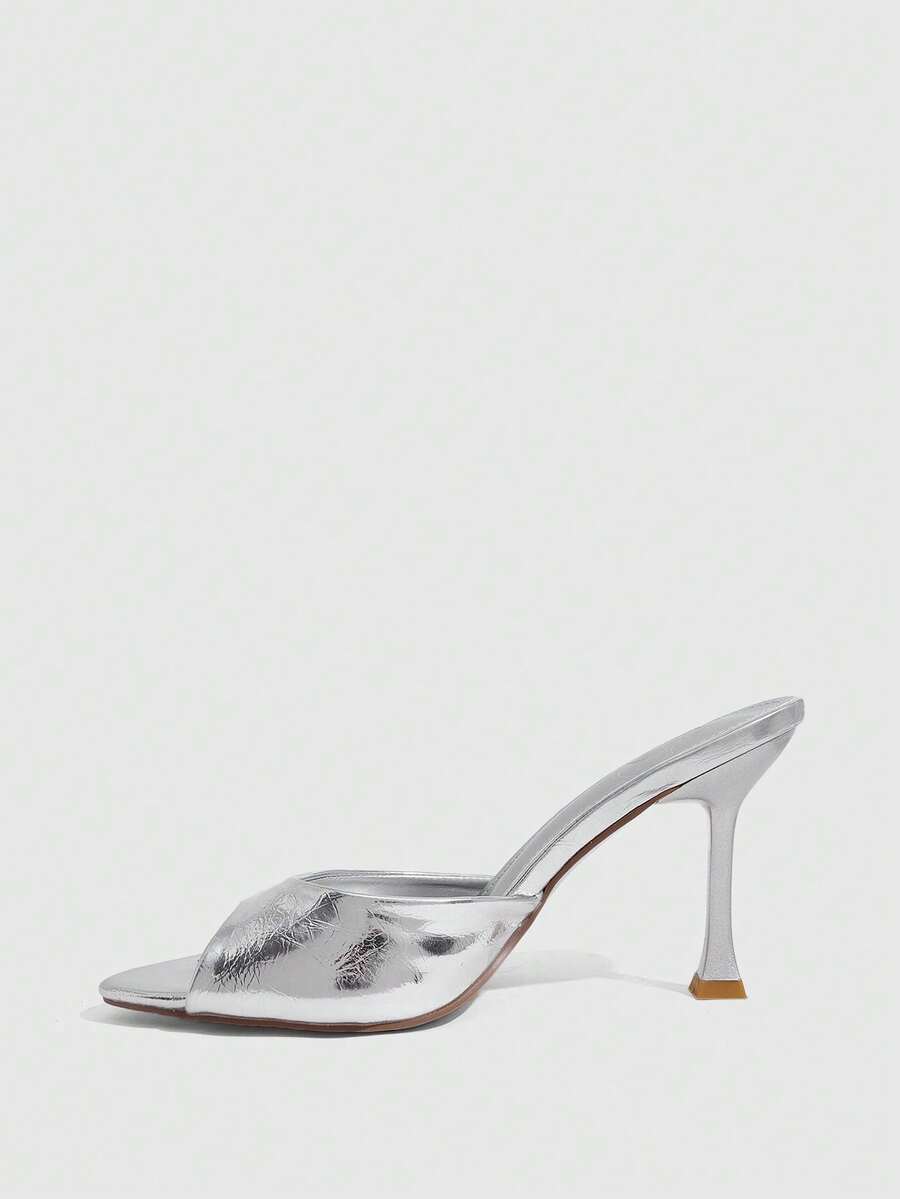 Women's sleek high heel slingback sandals with PU leather finish and stylish pyramid heel.