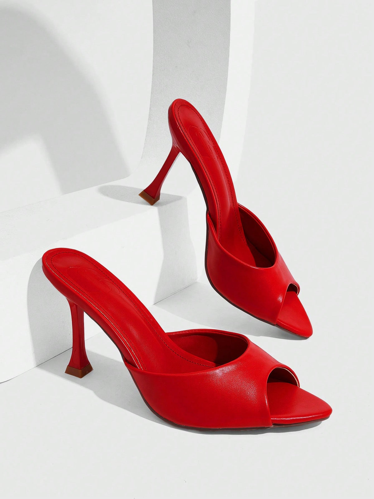 Women's sleek high heel slingback sandals with PU leather finish and stylish pyramid heel.