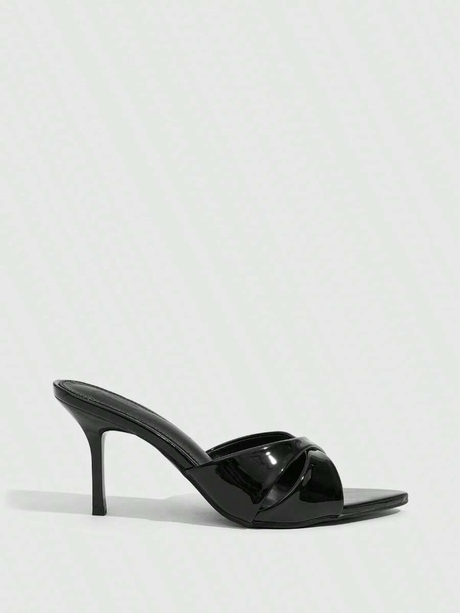 Women's black pointed high heel slingback sandals with stiletto heels for wedding and party wear