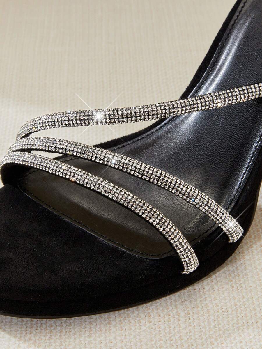 Open square toe high heel sandals with sparkling rhinestone straps, an adjustable ankle buckle closure, and a sleek stiletto heel.