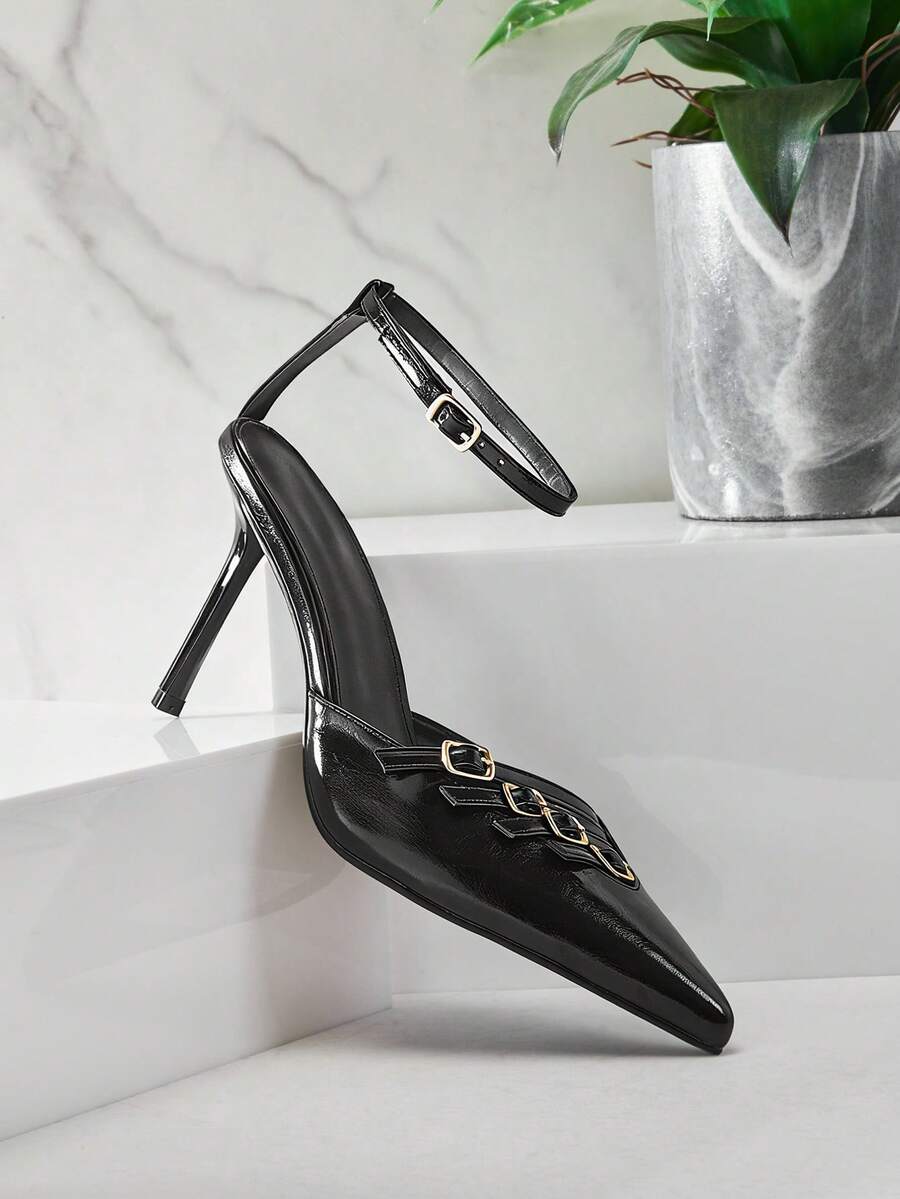Women's pointed toe stiletto heel slingback pumps in chocolate brown with double metal buckle strap details.