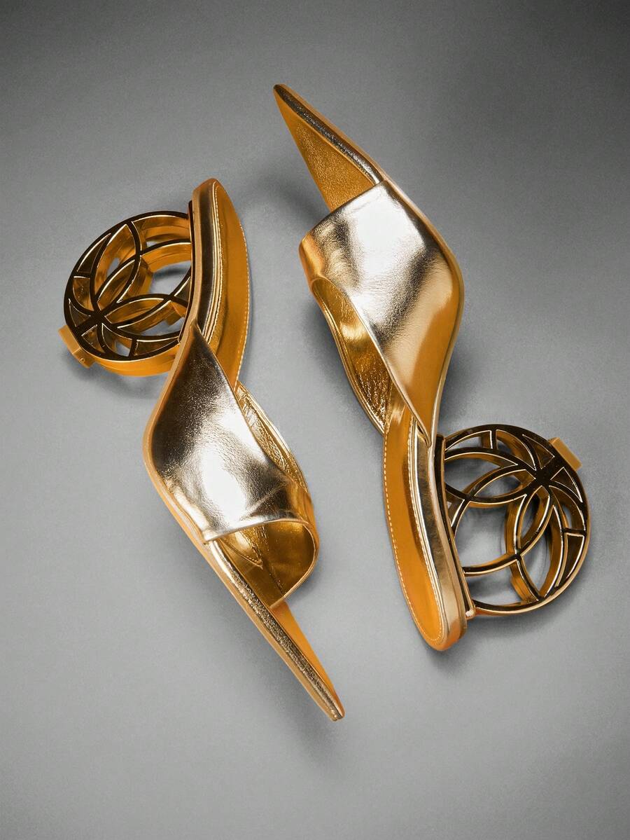 Women's slip-on heeled sandals in gold PU leather featuring a pointed toe and sculptural ball-shaped mid heel.