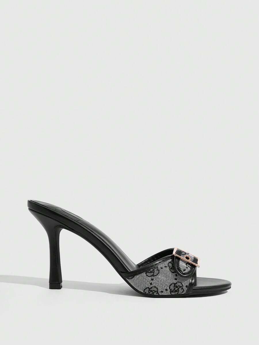 Women's brown leopard print high heel mule sandals with gold-tone buckle and grommet eyelet accents.