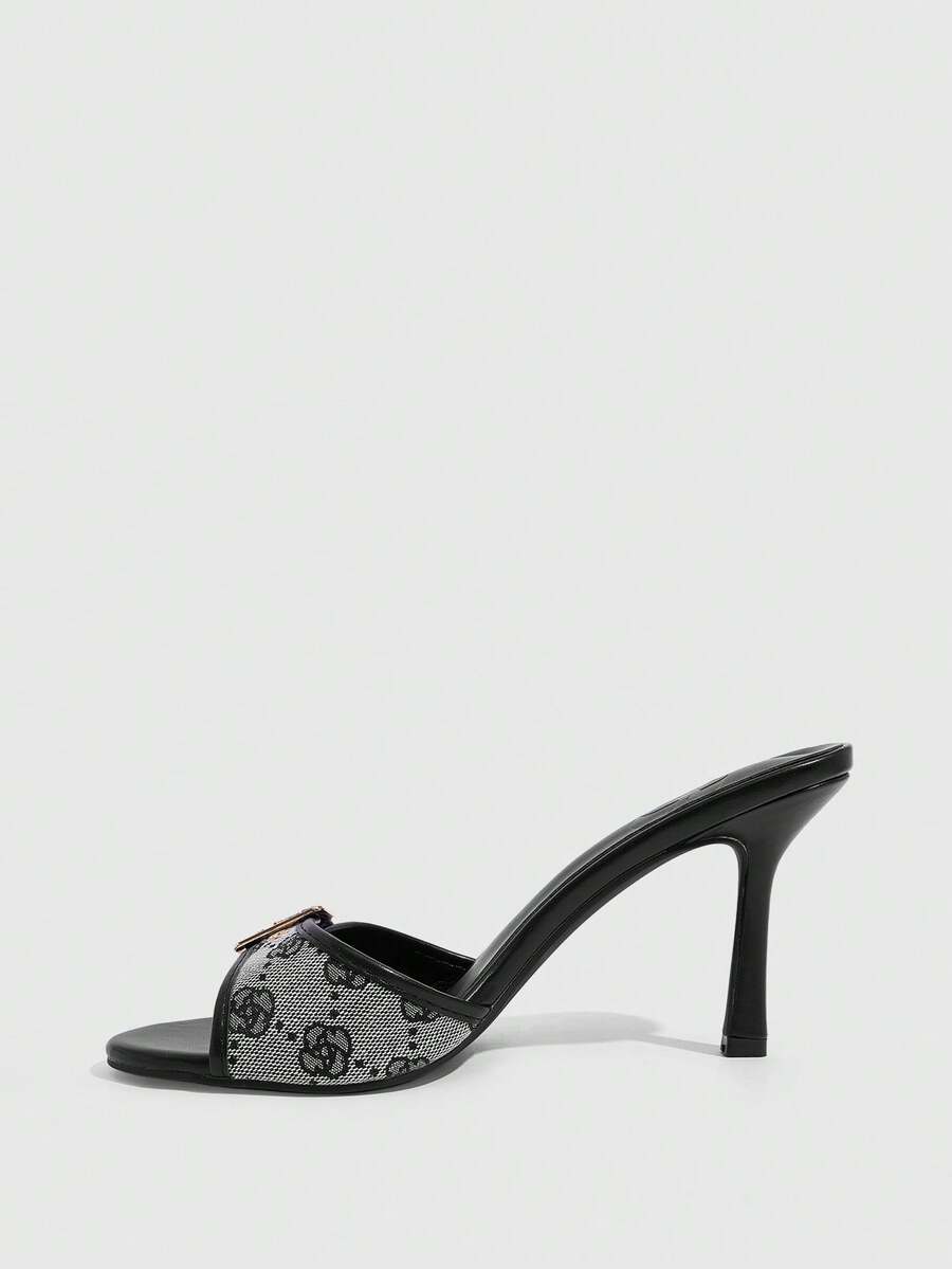 Women's brown leopard print high heel mule sandals with gold-tone buckle and grommet eyelet accents.