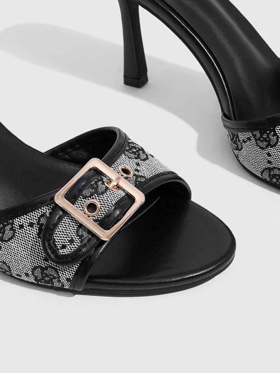 Women's brown leopard print high heel mule sandals with gold-tone buckle and grommet eyelet accents.