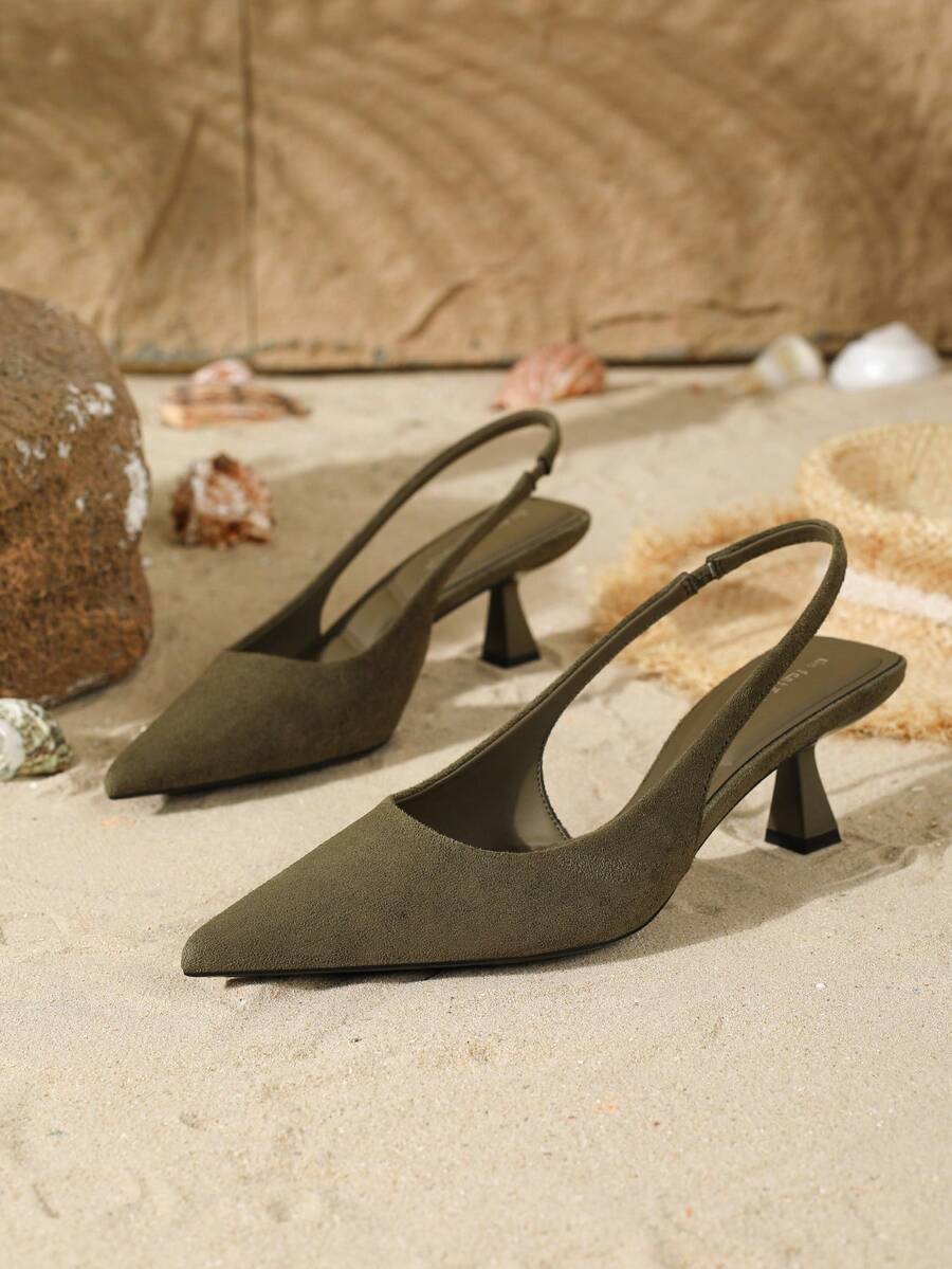 Women's elegant velvet kitten heel slingback pumps featuring a pointed closed toe and slip-on strap design.