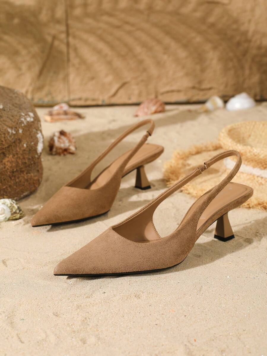Women's elegant velvet kitten heel slingback pumps featuring a pointed closed toe and slip-on strap design.
