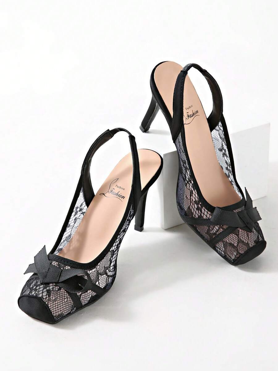 Black lace high heel sandals for women with a big bowknot, closed square toe, and stiletto heel.