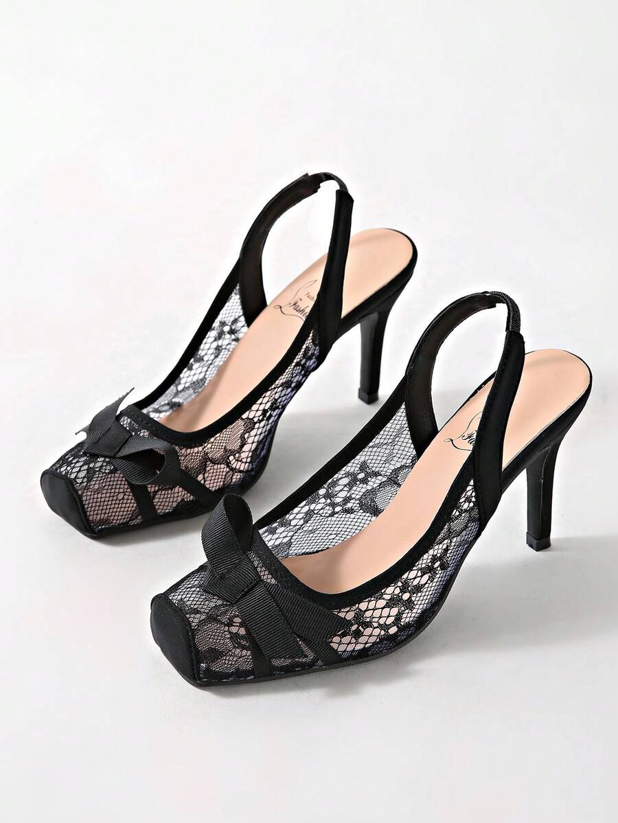 Black lace high heel sandals for women with a big bowknot, closed square toe, and stiletto heel.
