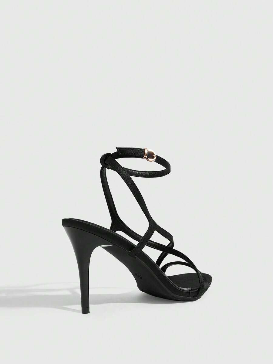 Square toe stiletto high heel sandals in deep burgundy satin featuring criss cross straps and an open toe design.