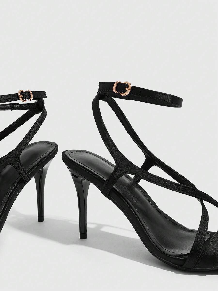 Square toe stiletto high heel sandals in deep burgundy satin featuring criss cross straps and an open toe design.