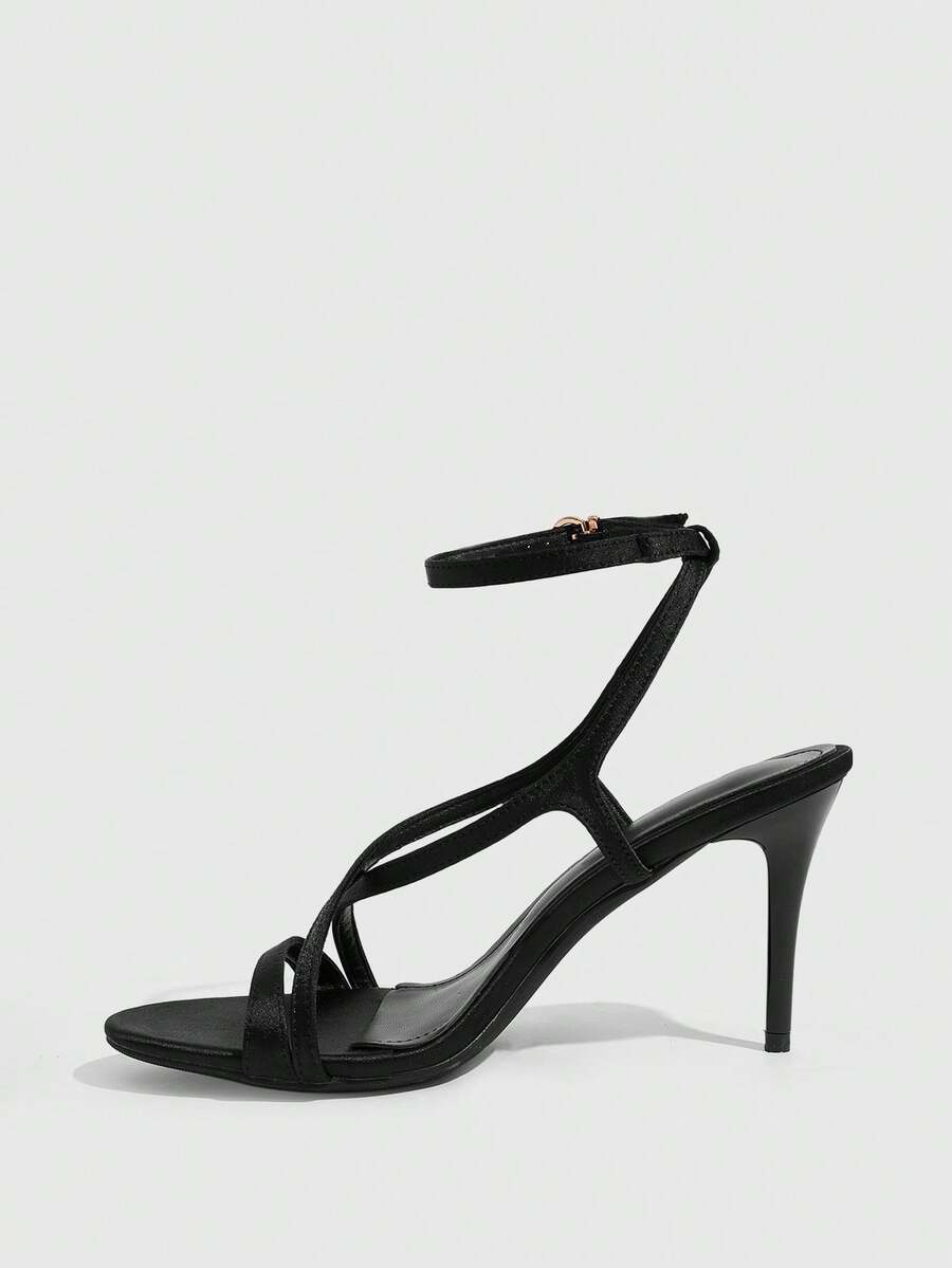 Square toe stiletto high heel sandals in deep burgundy satin featuring criss cross straps and an open toe design.