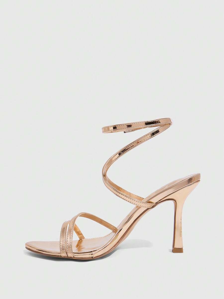 Women's square toe stiletto high heeled sandals with ankle strap buckle in a sleek faux leather finish.