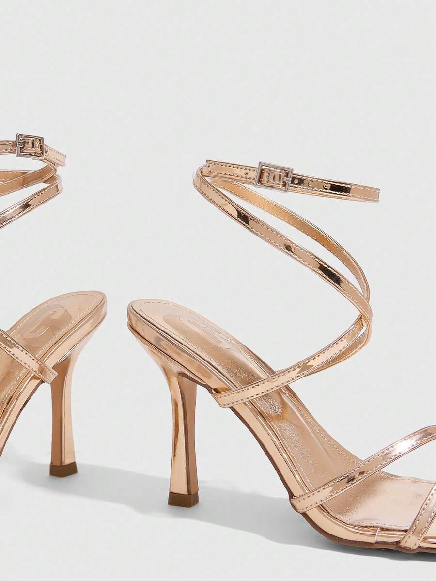 Women's square toe stiletto high heeled sandals with ankle strap buckle in a sleek faux leather finish.