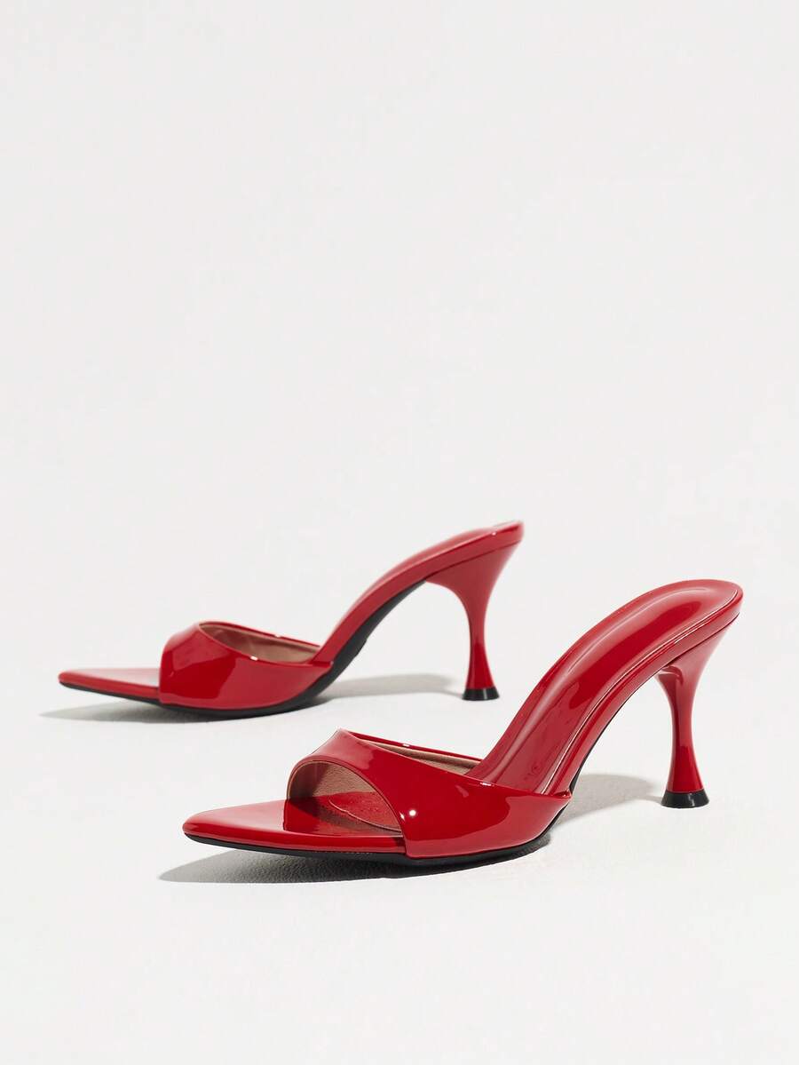 Women's open pointed toe stiletto mule high heel sandals featuring a glossy slip-on design.