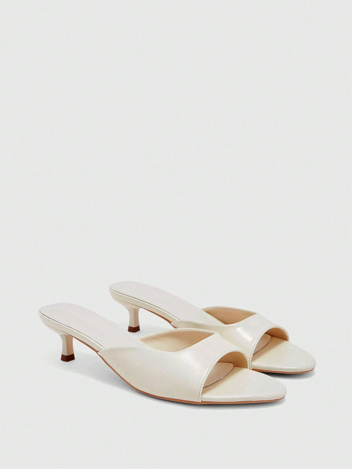 Pair of women's open toe high heel slingback sandals made with smooth PU leather