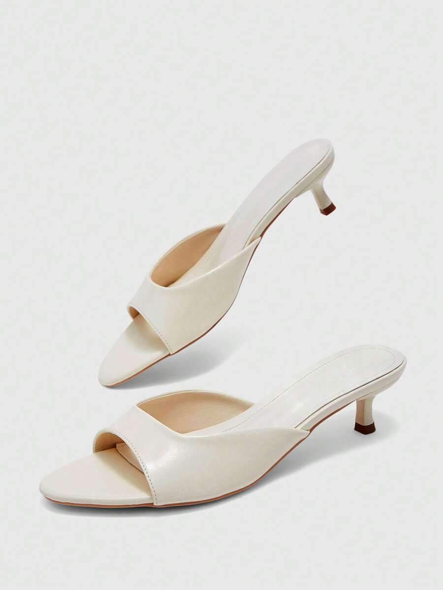 Pair of women's open toe high heel slingback sandals made with smooth PU leather