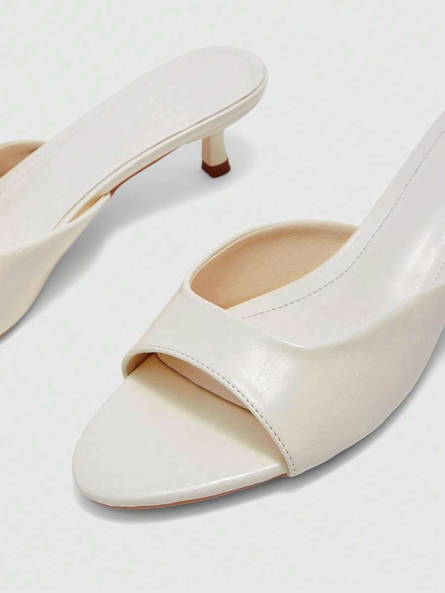 Pair of women's open toe high heel slingback sandals made with smooth PU leather