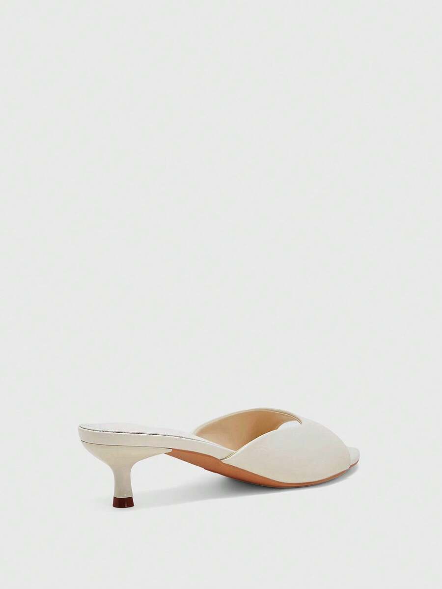 Pair of women's open toe high heel slingback sandals made with smooth PU leather