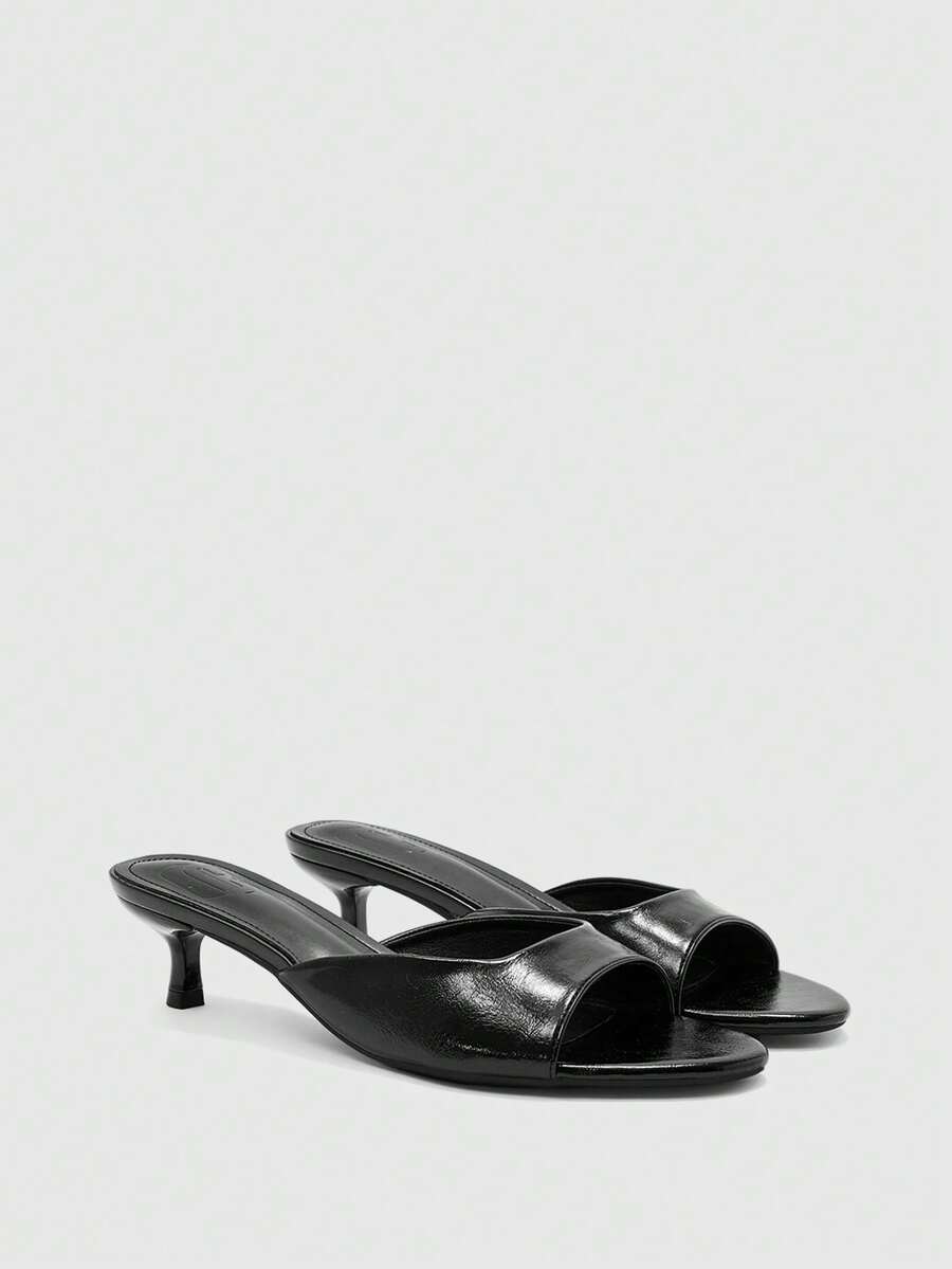 Pair of women's open toe high heel slingback sandals made with smooth PU leather
