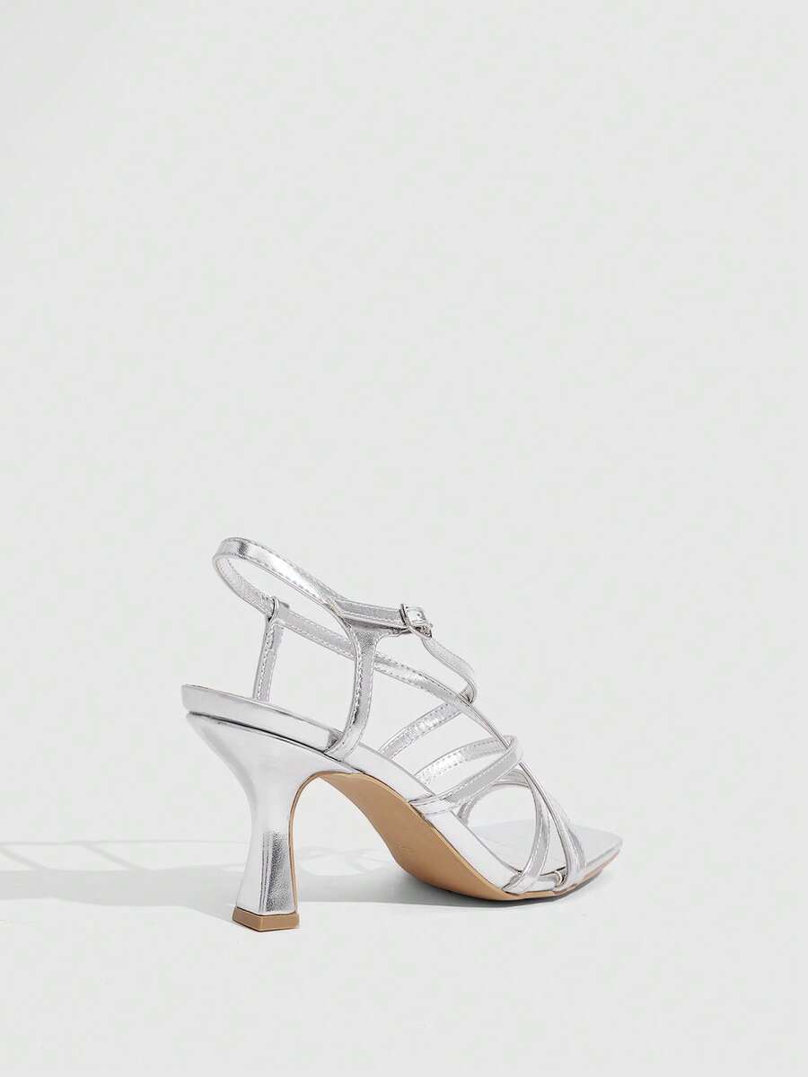 Women's metallic square toe Roman high heel sandals featuring cross straps and adjustable ankle buckle.