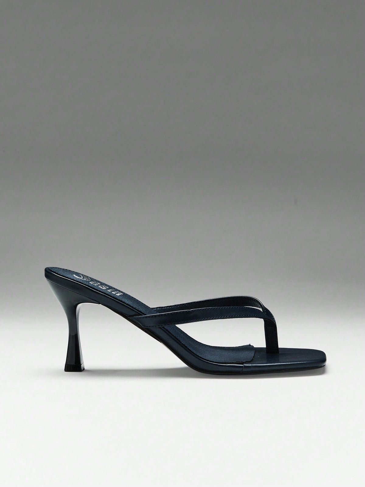 Women's square toe kitten heel thong heeled sandals featuring an asymmetrical strap design and mid heel