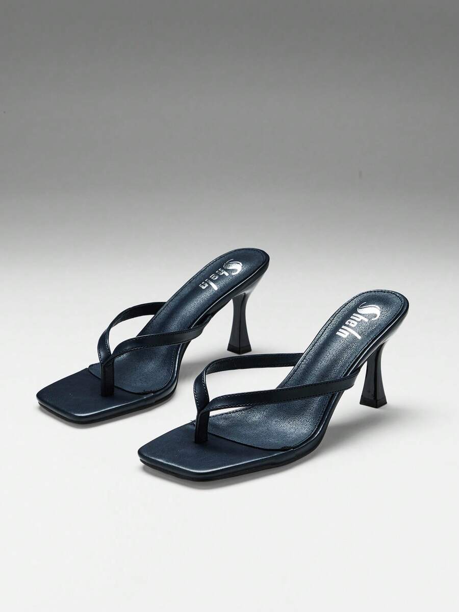 Women's square toe kitten heel thong heeled sandals featuring an asymmetrical strap design and mid heel