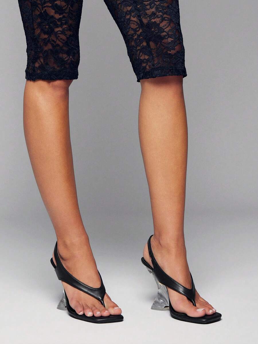 Women's slip-on thong strap wedge sandals featuring a high wedge heel and smooth PU leather upper.