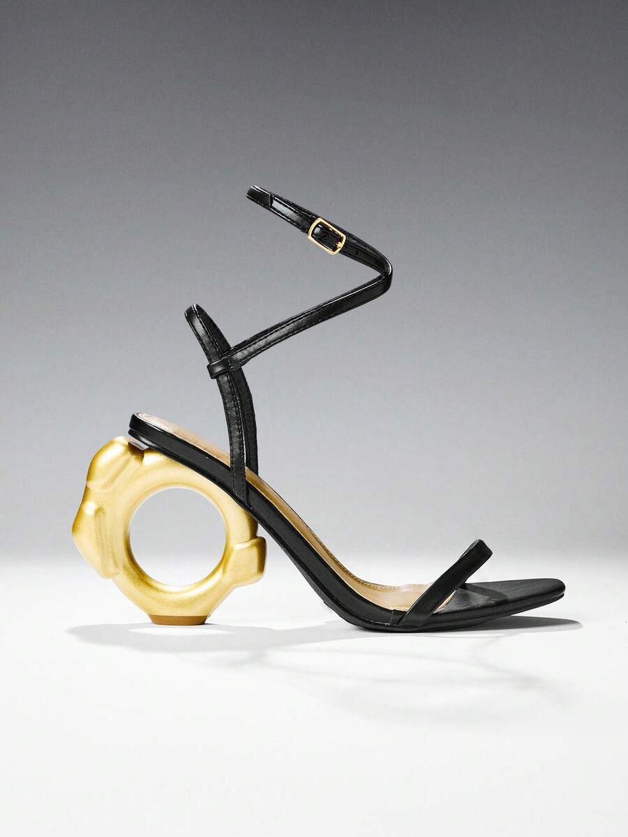 Women's slip-on heeled sandals in gold PU leather featuring a pointed toe and sculptural ball-shaped mid heel.