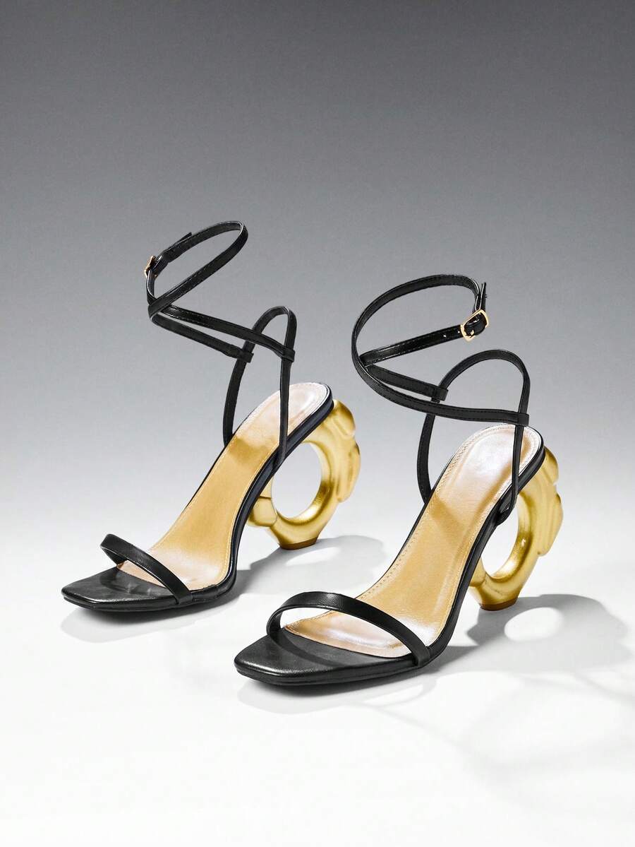 Women's slip-on heeled sandals in gold PU leather featuring a pointed toe and sculptural ball-shaped mid heel.