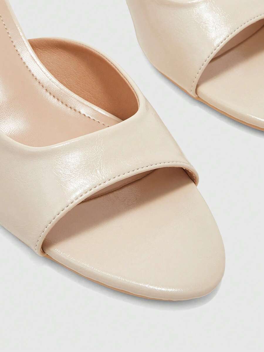 Pair of women's open toe high heel slingback sandals made with smooth PU leather